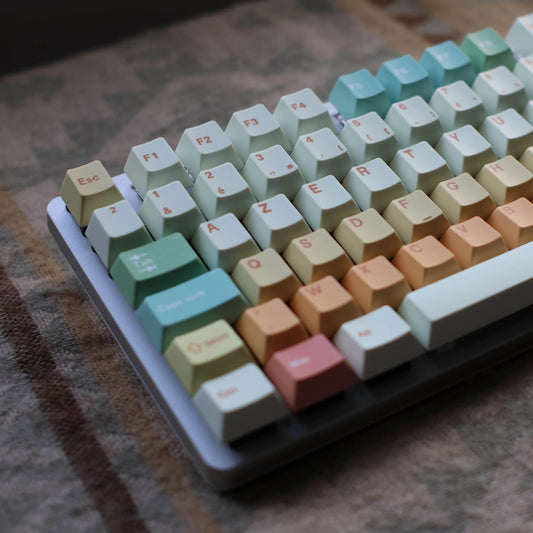 Colorful keyboard with pastel keycaps on a textured surface