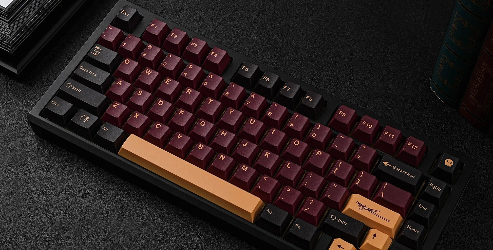 Mechanical keyboard with red and orange keycaps on a dark surface