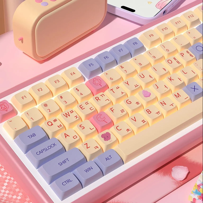Keyboard with decorative keycaps on a pink surface