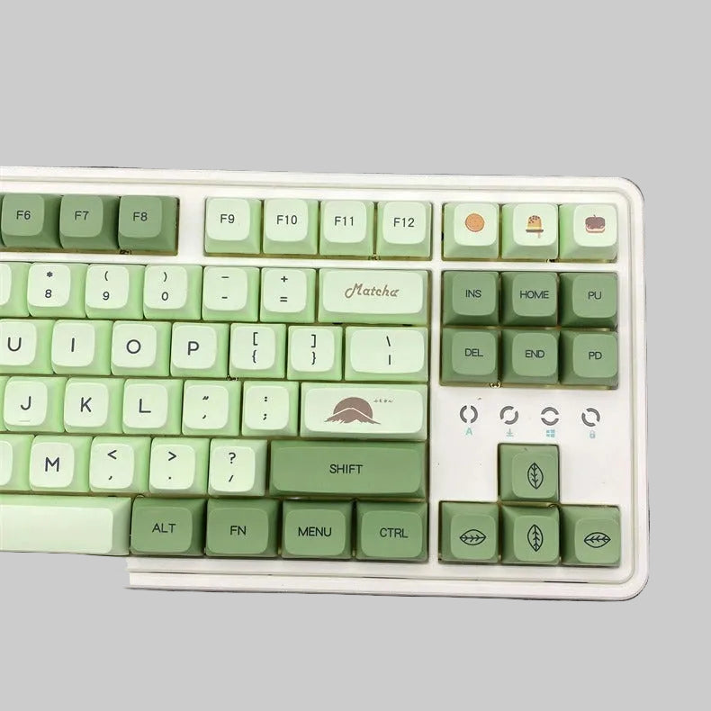 Green and white keyboard on a gray surface
