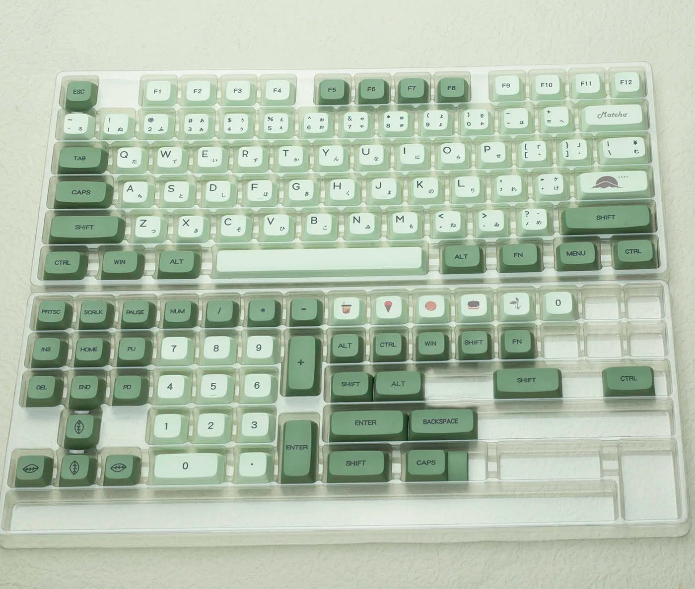 Keyboard with green and white keys on a light gray background